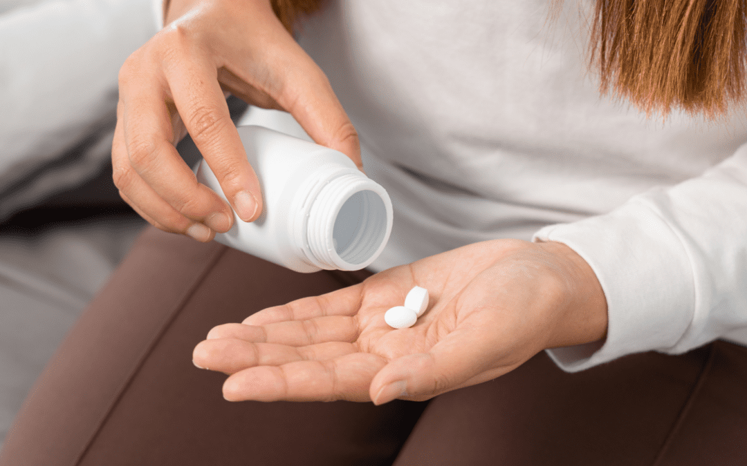 woman taking an abortion pill