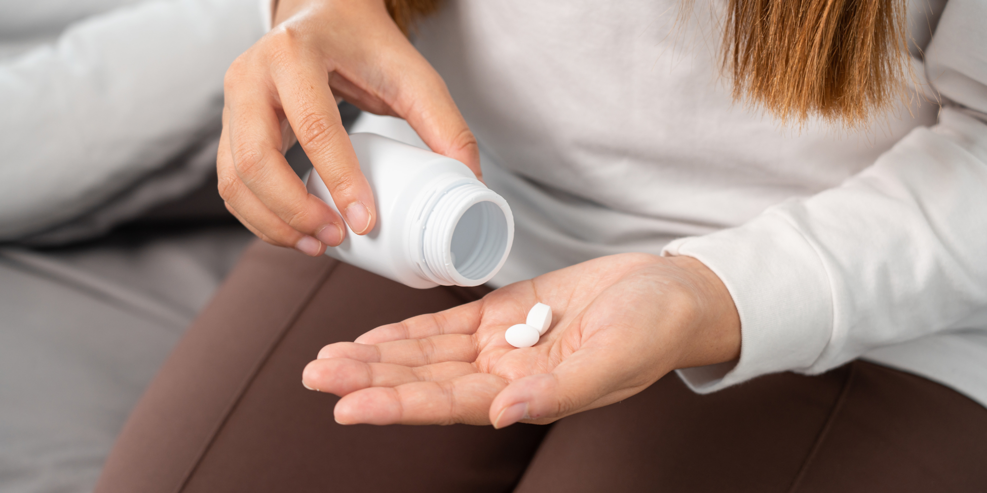 woman taking an abortion pill