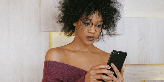 How Long Does an Abortion Take? A woman searching on her phone "how long does an abortion take?"