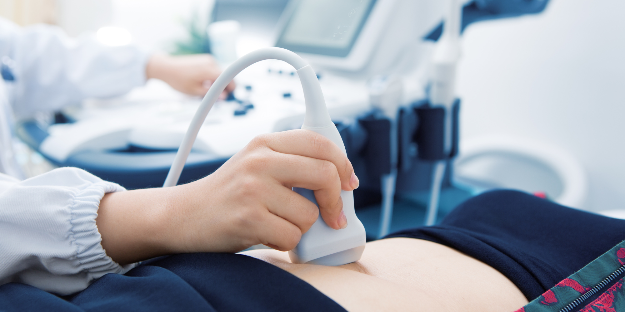 doctor providing woman with ultrasound