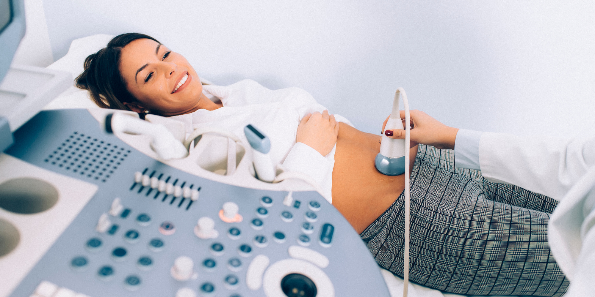 woman smiling receiving an ultrasound