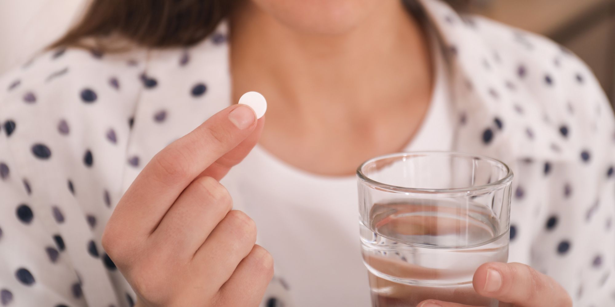 woman taking abortion pill