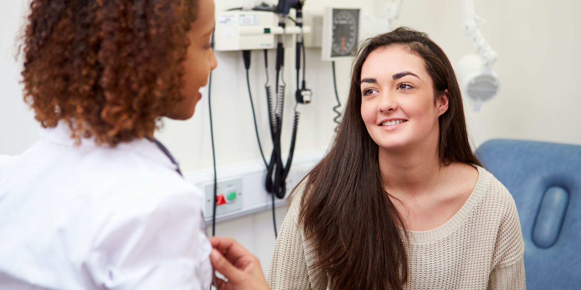 woman smiling receiving an ultrasound